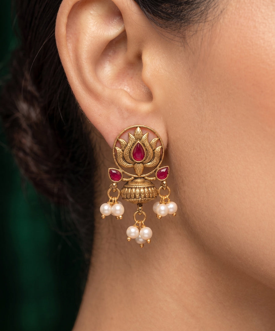 Women Antique Gold-Plated Lotus Motif Stud Earrings with Pink Stones & Pearl