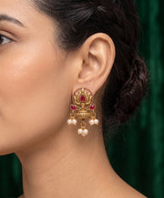 Women Antique Gold-Plated Lotus Motif Stud Earrings with Pink Stones & Pearl
