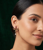 Women Antique Gold-Plated Goddess Durga Face Stud Earrings with Green Stones & Pearls